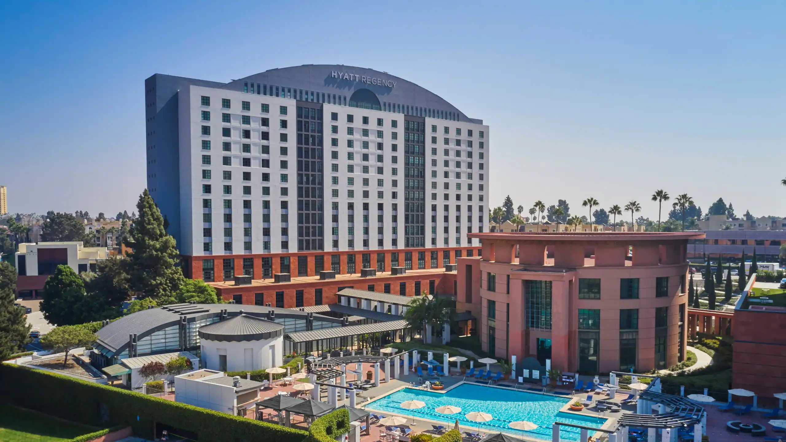 Exterior of the Hyatt Regency La Jolla at Aventine with its tower and resort pool